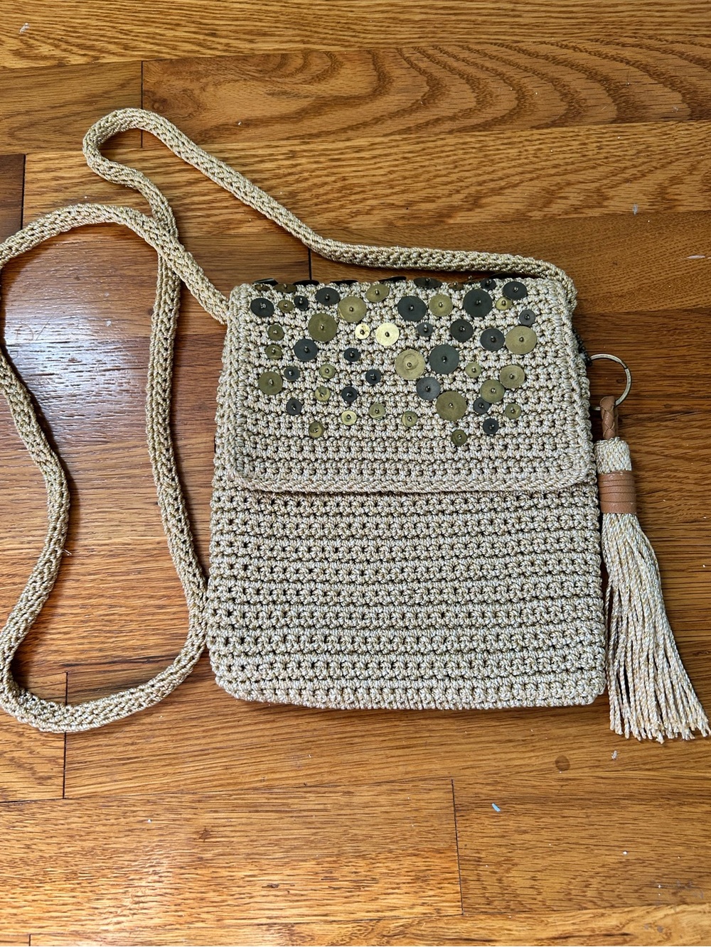 The SAK Metallic Gold Beige Crochet Crossbody Bag with Tassel